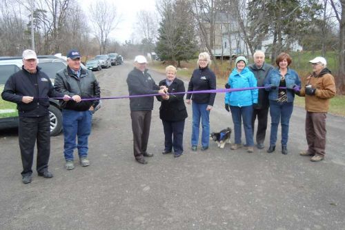 Dignitaries from the county and township, and trail representatives, along with members of the local business community cut the ribbon at the official opening of the K&P Trail in Tichborne